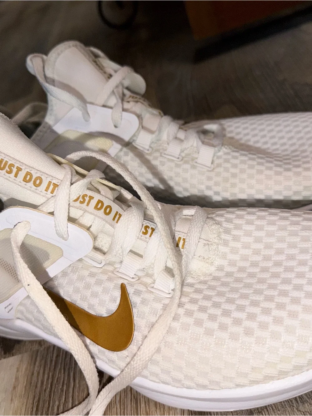 Nike Women's White Athletic Sneakers with Gold Swoosh